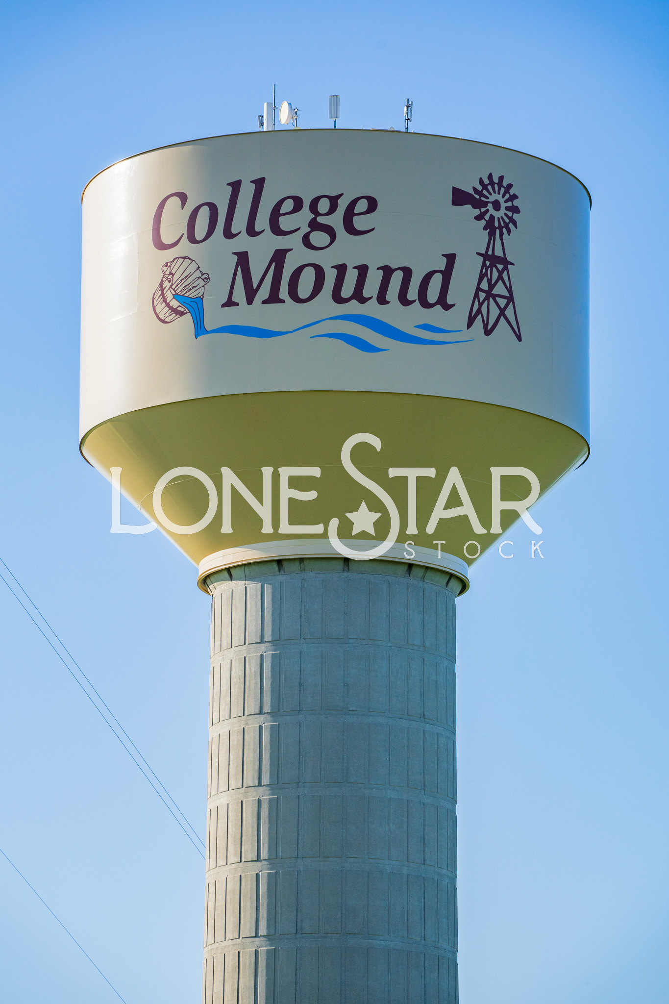 Preview of Yellow, Brown, and Blue College Mound Water Tower with Image of Windmill in Front of Clear Blue Sky